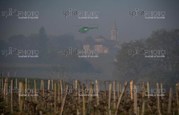 Helicopter being used to circulate warmer air and prevent frost damage to vineyard in sub-zero spring temperatures of 7 April 2021. Château Fombauge, St-Émilion, Gironde, France. [Saint-Émilion / Bordeaux] (JBN_3749.jpg)